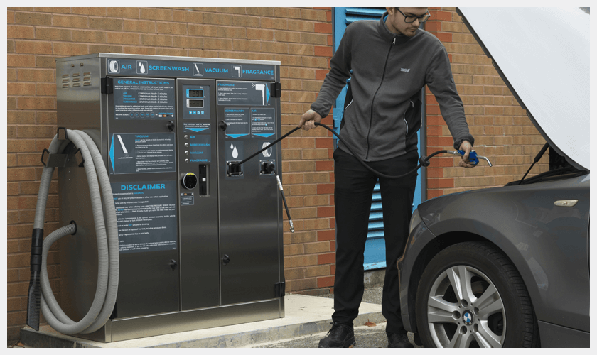 PCL - Man using screenwash option on Multi-unit on a Forecourt