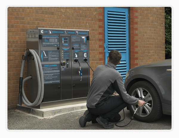 Man inflating tyres with PCL's Multi-Function Digital Forecourt Tower