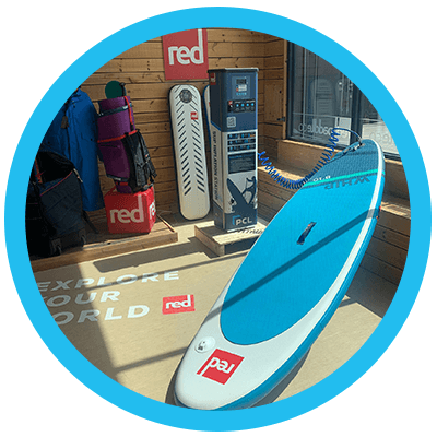 Dual-branded PCL and Red Paddle Co) SUP Inflation Station inflating paddleboard in Red Paddles Store