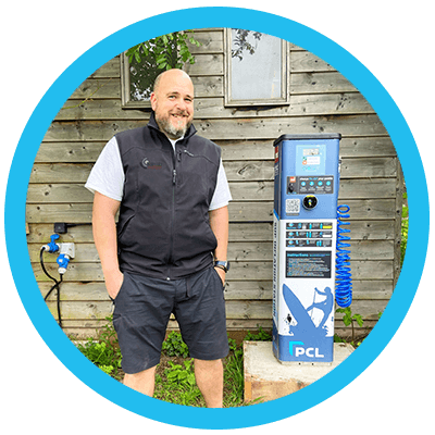Arwell Philiips owener of SUP-Air Cymru standing next to PCL's SUP Inflation Station